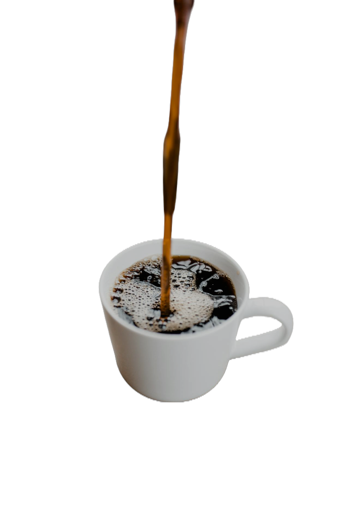 Stream of coffee pouring into a white ceramic cup, creating bubbles on the dark surface of the coffee; the cup sits against a plain black background, evoking a sense of warmth and focus